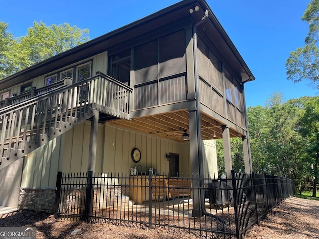 view of property exterior featuring a garage and fence