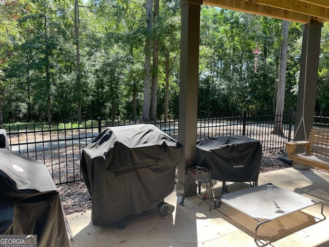 view of patio with fence and grilling area