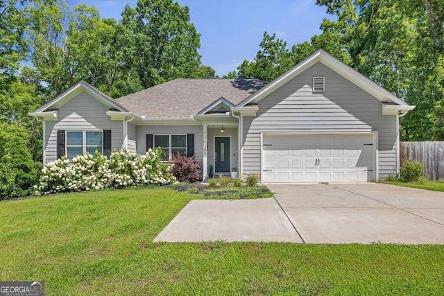 single story home with an attached garage, fence, driveway, roof with shingles, and a front lawn