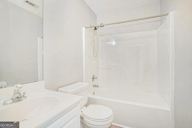 bathroom featuring a textured ceiling, shower / bathtub combination, toilet, vanity, and visible vents