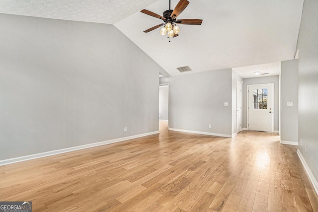 unfurnished living room with a ceiling fan, visible vents, light wood-style flooring, and baseboards