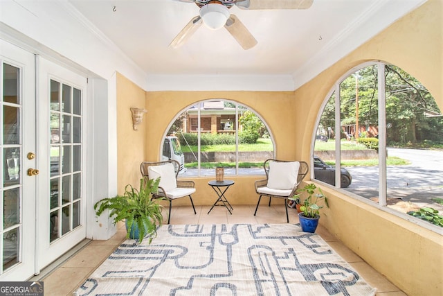 sunroom / solarium with ceiling fan and french doors