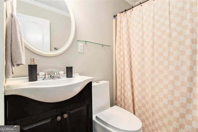 bathroom with ornamental molding, curtained shower, vanity, and toilet