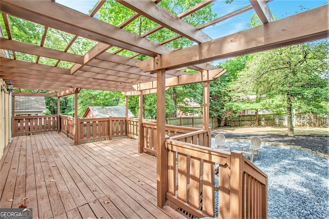 wooden deck with fence and a pergola