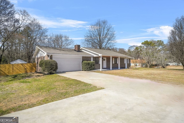 ranch-style house with a garage, brick siding, fence, concrete driveway, and a front lawn