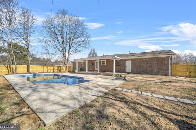 view of pool featuring a patio area, a fenced backyard, and a fenced in pool