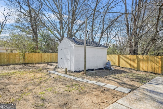 view of shed featuring a fenced backyard