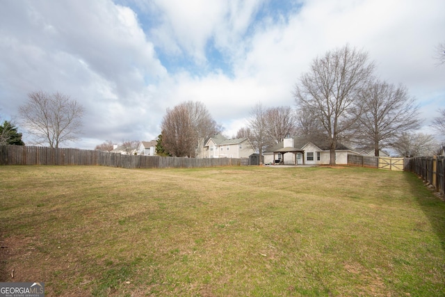 view of yard featuring a fenced backyard