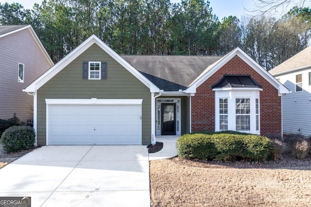 ranch-style home featuring a garage, driveway, and brick siding