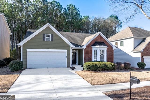 view of front of house with concrete driveway and brick siding