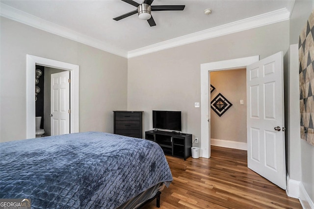 bedroom featuring a ceiling fan, wood finished floors, baseboards, and ornamental molding