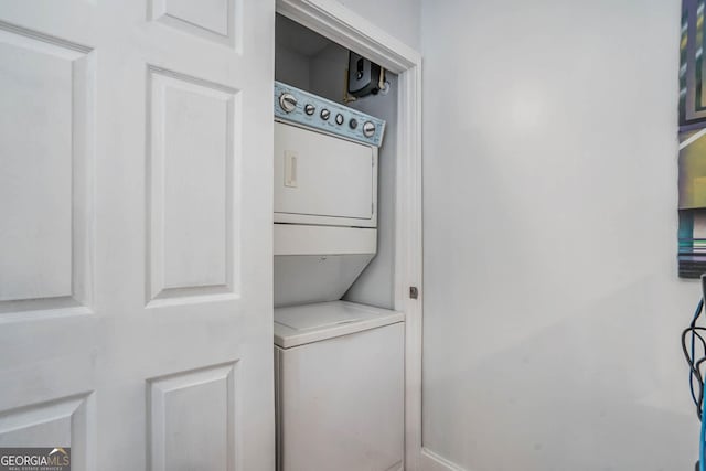 laundry area featuring laundry area and stacked washing maching and dryer