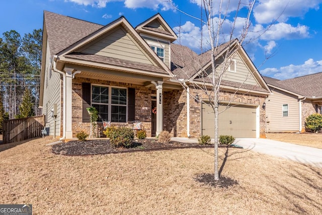 view of front of property featuring a garage, covered porch, brick siding, a shingled roof, and concrete driveway