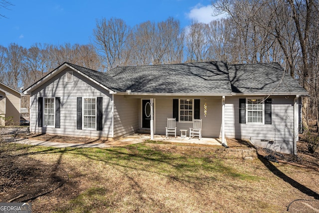 single story home featuring crawl space, roof with shingles, a porch, and a front yard