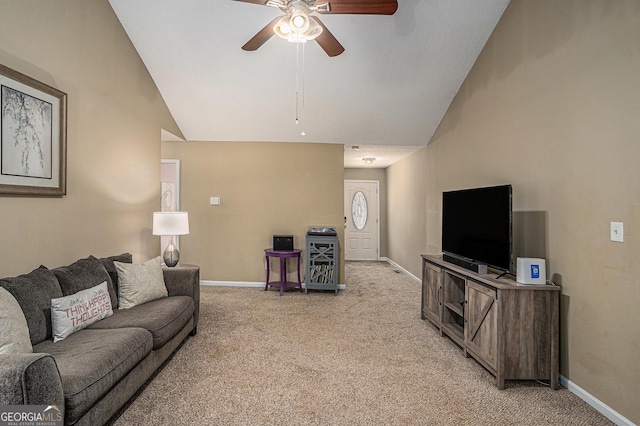 living area with lofted ceiling, light carpet, and baseboards