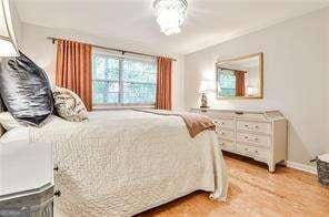 bedroom featuring light wood-style floors