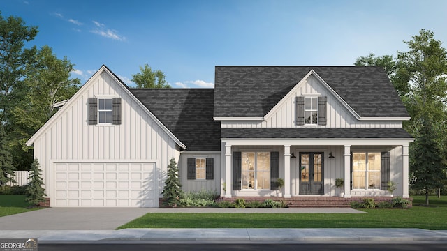 modern farmhouse with a porch, concrete driveway, and board and batten siding