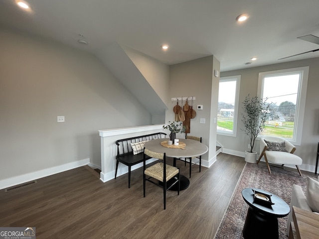 dining space featuring baseboards, visible vents, wood finished floors, and recessed lighting