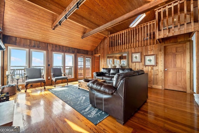 living room with wood ceiling and wood walls