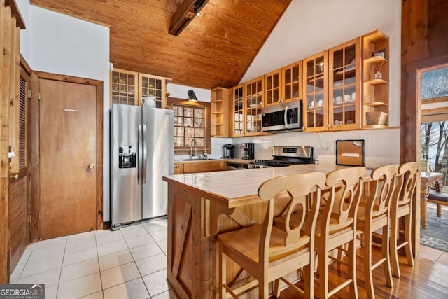 kitchen with a peninsula, a sink, wood ceiling, appliances with stainless steel finishes, and open shelves