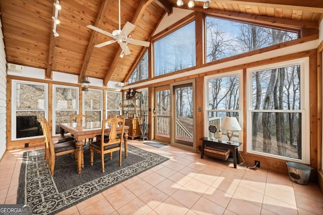 sunroom / solarium featuring a ceiling fan, wooden ceiling, and lofted ceiling with beams