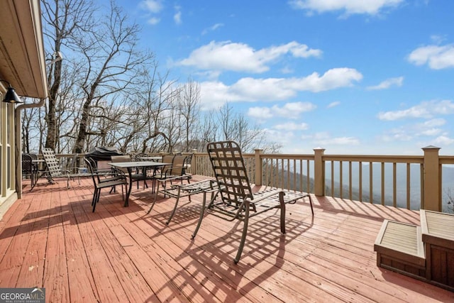 wooden deck with outdoor dining area