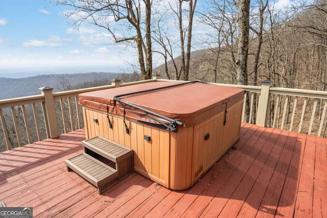 deck featuring a hot tub