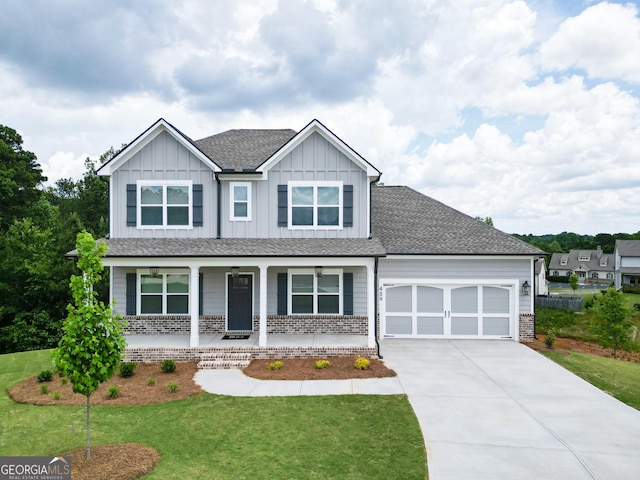459 Banff Dr, Winder, GA 30680 - craftsman house with an attached garage, covered porch, concrete driveway, a front lawn, and board and batten siding