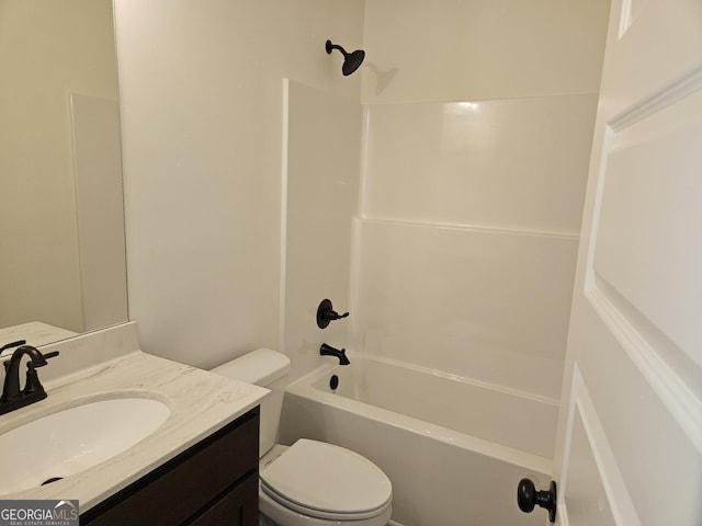 bathroom with toilet, shower / washtub combination, and vanity