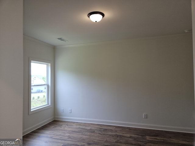 459 Banff Dr, Winder, GA 30680 - spare room featuring dark wood finished floors, crown molding, and baseboards