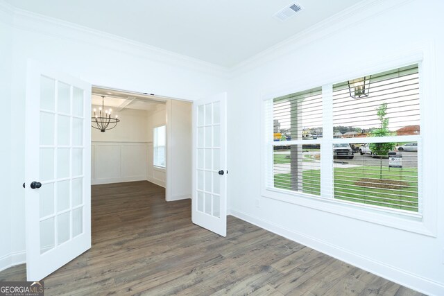 459 Banff Dr, Winder, GA 30680 - spare room with a chandelier, ornamental molding, wood finished floors, french doors, and baseboards