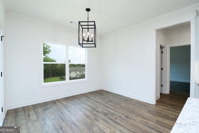 459 Banff Dr, Winder, GA 30680 - unfurnished dining area with a chandelier, crown molding, dark wood-style floors, and baseboards