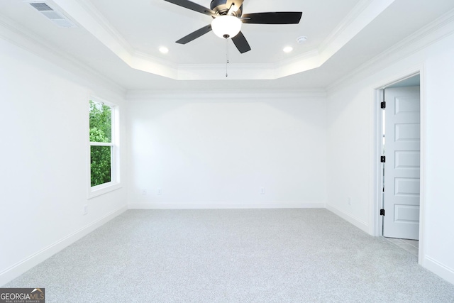 459 Banff Dr, Winder, GA 30680 - spare room with light carpet, a tray ceiling, ornamental molding, a ceiling fan, and recessed lighting