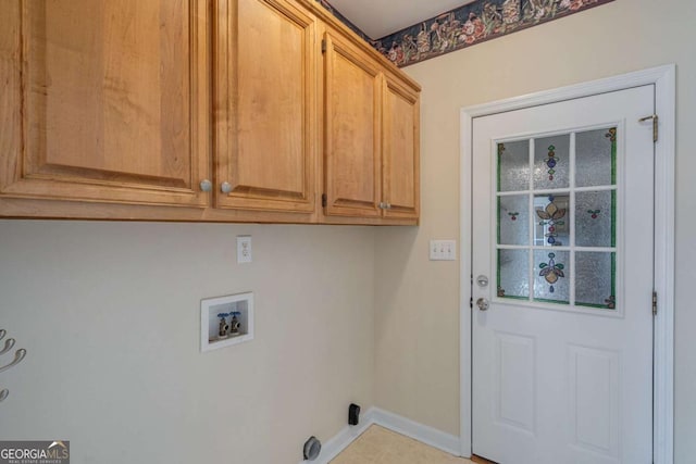 laundry room with hookup for a washing machine, cabinet space, and baseboards