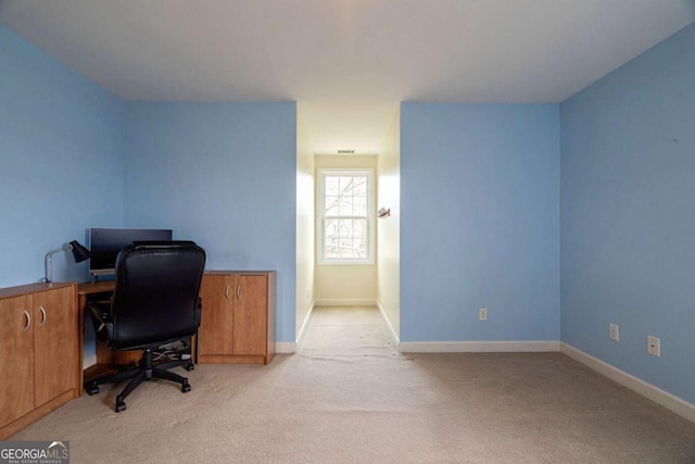 office space with light colored carpet and baseboards