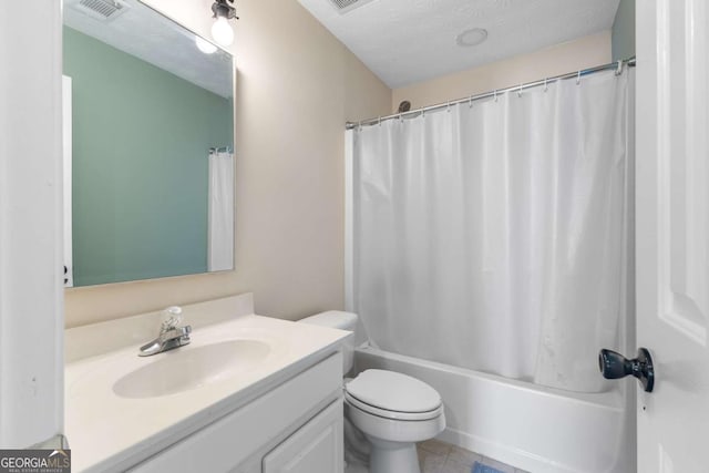 bathroom featuring vanity, shower / tub combo, visible vents, and a textured ceiling