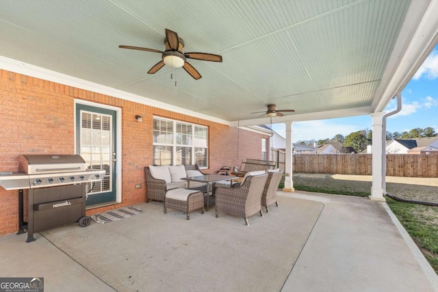 view of patio / terrace featuring grilling area, an outdoor hangout area, a ceiling fan, and fence