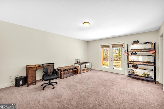 office space with french doors, carpet flooring, and baseboards