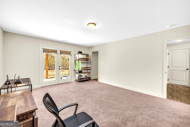 living area with carpet, french doors, visible vents, and baseboards