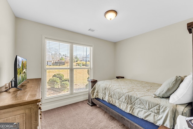 bedroom featuring carpet flooring and visible vents