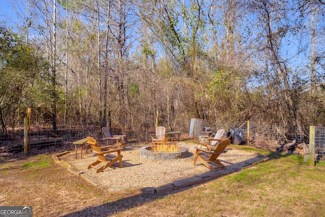 view of yard with a fire pit