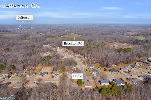 birds eye view of property with a residential view