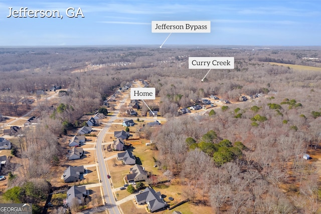 bird's eye view featuring a residential view and a view of trees