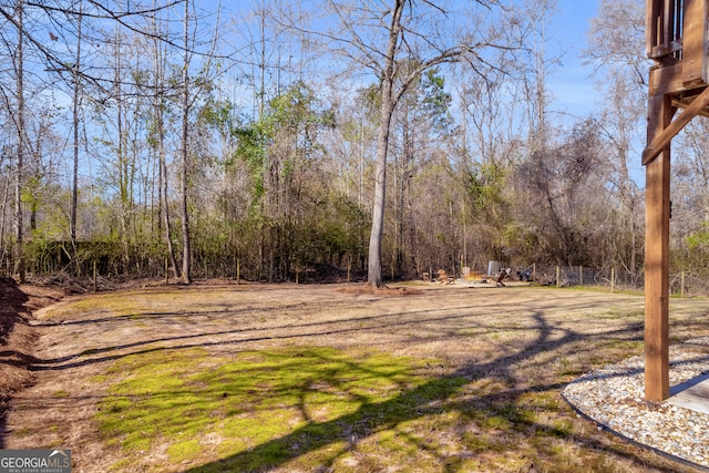 view of yard with a wooded view