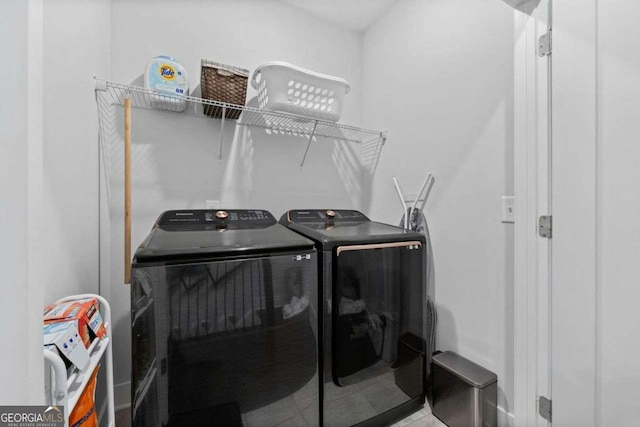 laundry room featuring laundry area and washing machine and dryer