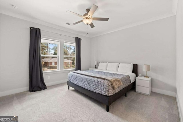 bedroom with ornamental molding, visible vents, carpet floors, and baseboards