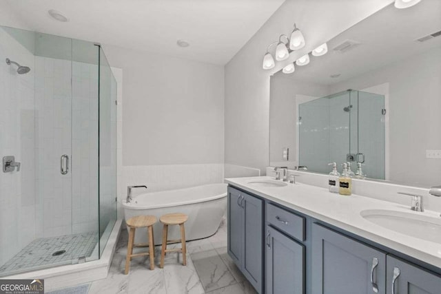 bathroom with a stall shower, visible vents, and a sink