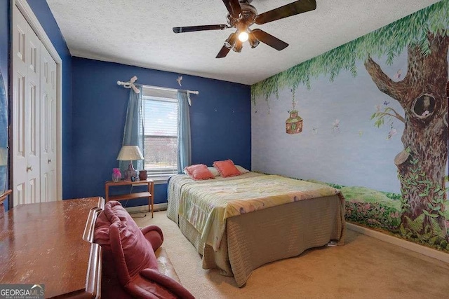 carpeted bedroom with a textured ceiling, wallpapered walls, a ceiling fan, and baseboards