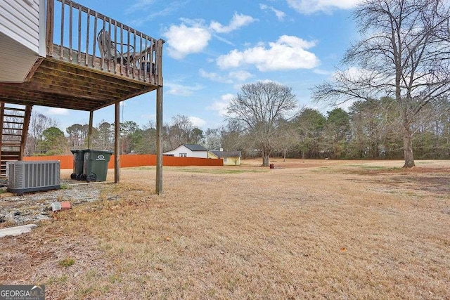 view of yard with stairway and central AC unit