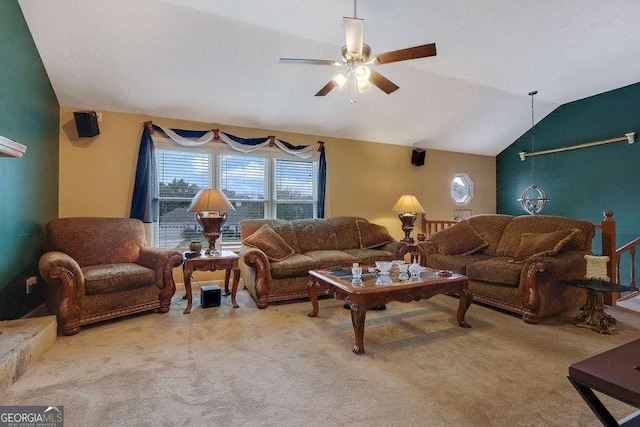 carpeted living room featuring ceiling fan and vaulted ceiling